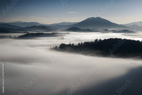 Mountains and valley blanketed in thick fog.  © ECrafts