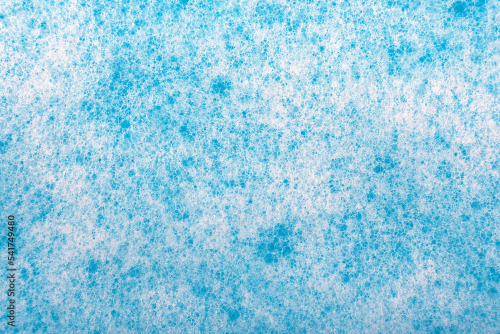 Soap foam. Background of dusty foam with bubbles of blue color for an inscription. Soap sud with copy-space Soap foam. Background of dusty foam with bubbles of blue color for an inscription. Soap sud with copy-space
