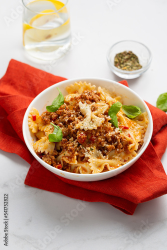 Close up of italian pasta bolognese in white bowl