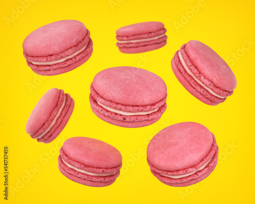Flying pink macaroons on a yellow background, 3d render