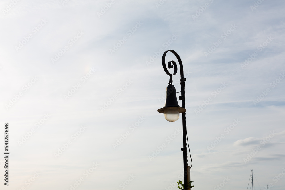Wrought iron street lamp very typical in the towns and cities of Catalonia. - obrazy, fototapety, plakaty 