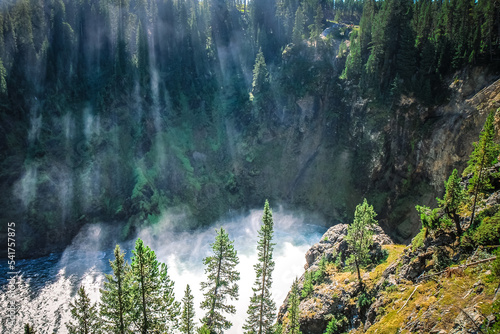 Yellowstone River with Sunlight and Mist Coming Through Trees in Yellowstone National Park