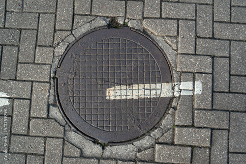 Sewer hatch on a street.