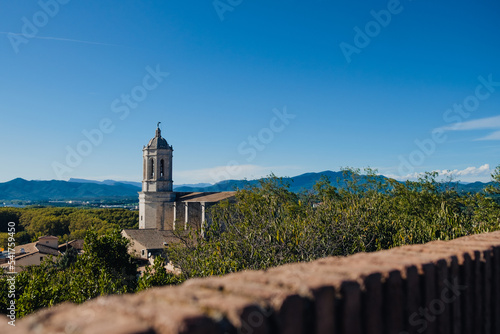 Girona, Spain, 22 October 2022: scenic landscape view of the Girona Cathedral from the roman walls. Landscape of the old city
