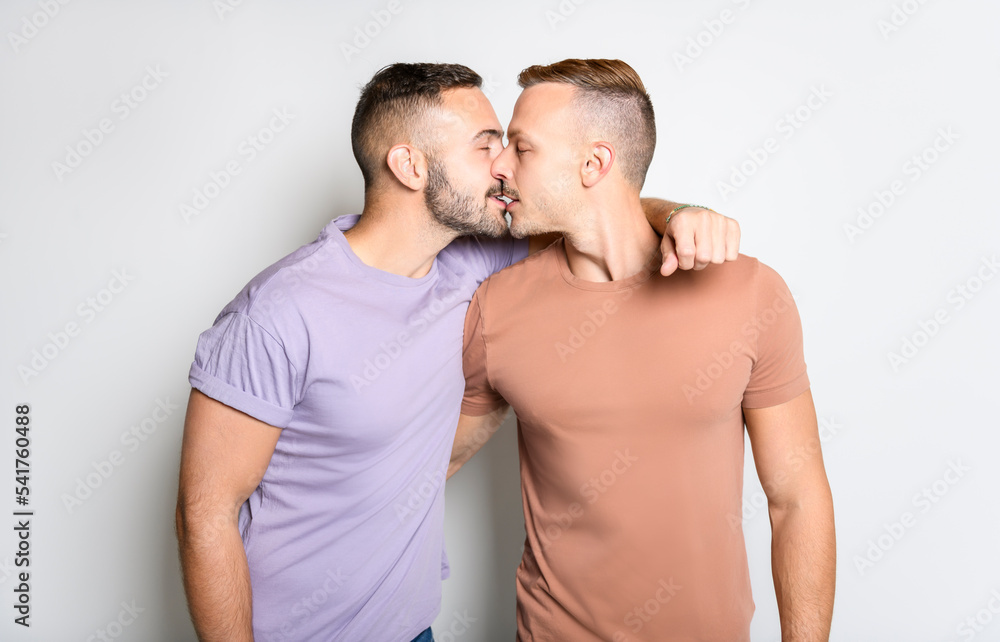 Two young men couple over white background on studio Two young men couple over white background on studio