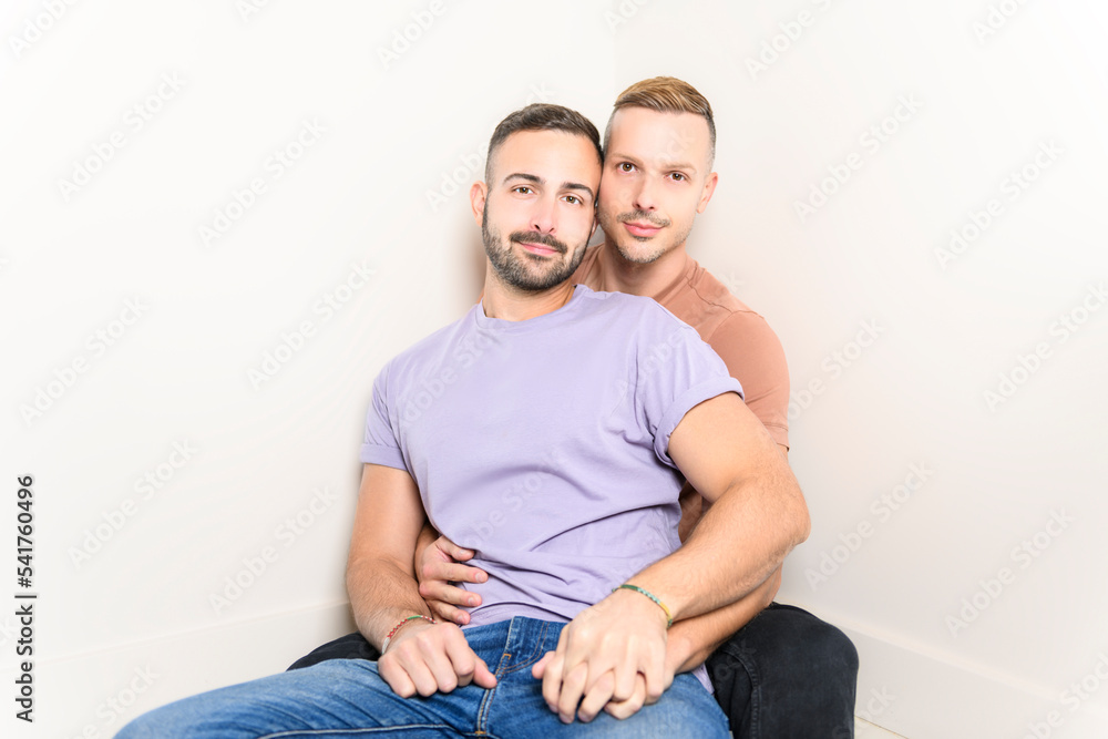 Two young men couple over white background on studio Two young men couple over white background on studio