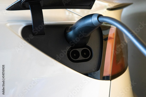 Electric vehicle on charge in the garage.