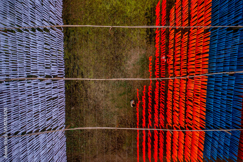 Aerial view of colourful fabric hanged to dry in Narayanganj, Bangladesh. photo