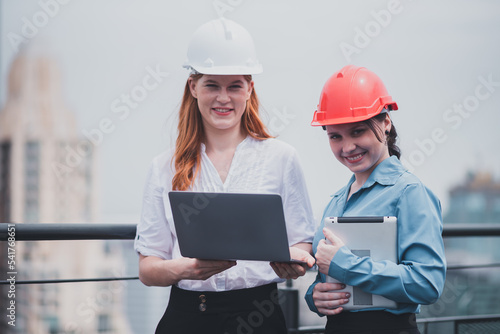 Businesswoman chatting with colleagues to make the company successful.Architects are confident in the construction of architecture.Girls talk teamwork with colleagues for success.