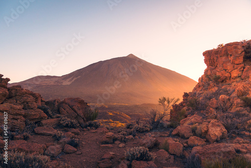 Amazing volcano landscape with rough rocky terrain at sunset