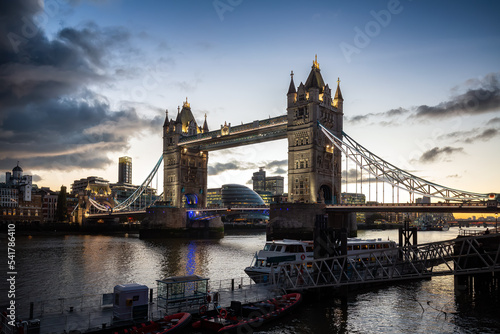Historic Bridge over River Thames and Cityscape Skyline during dramatic sunset. Tower Bridge in City of London, United Kingdom. Travel Destination