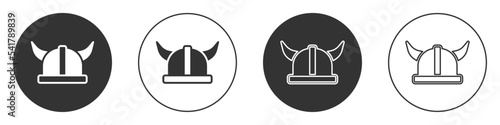Black Viking in horned helmet icon isolated on white background. Circle button. Vector