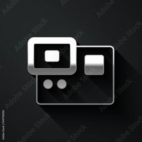 Silver Action extreme camera icon isolated on black background. Video camera equipment for filming extreme sports. Long shadow style. Vector