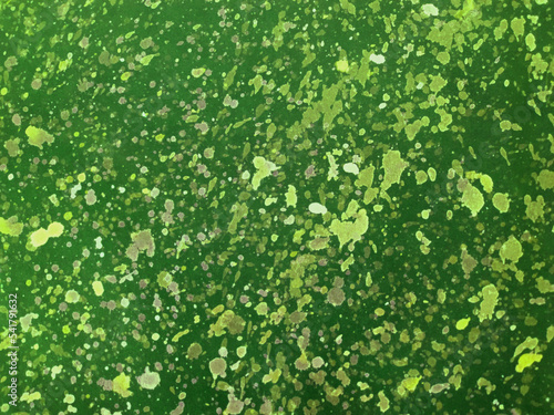 Bright green background of abstract watercolor splashes