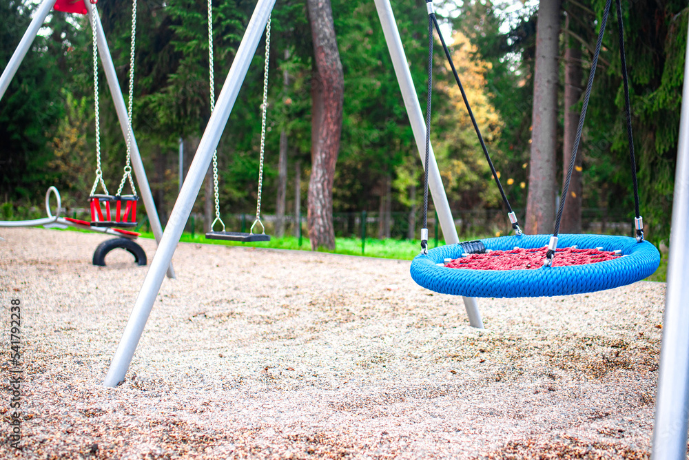 Colourful modern kids playground on the sunset.
