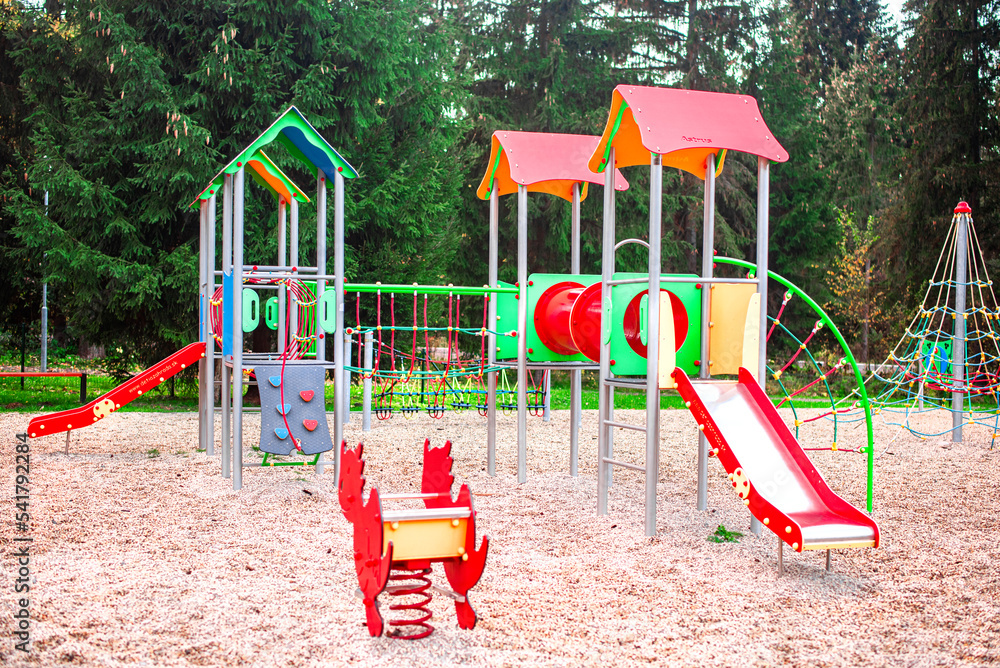 Colourful modern kids playground on the sunset. Colourful modern kids playground on the sunset.