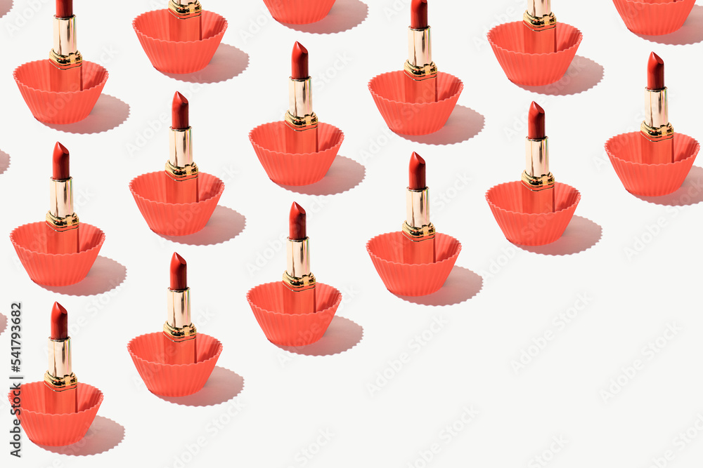 Perfect red lipsticks in silicone baking cupcake molds, creative fashion and beauty inspired pattern. Perfect red lipsticks in silicone baking cupcake molds, creative fashion and beauty inspired pattern.