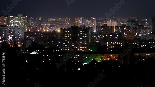 Wallpaper Mural Night Kyiv city. Time lapse. The light in the windows of houses. In many cities of Ukraine, there is an increased consumption of electricity due to attacks on the energy system of Ukraine Torontodigital.ca