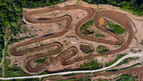 Sport. Motorsport, motocross. Dirt track for motocross, top view from a drone. Summer cloudy day.
