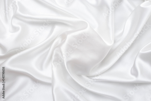 Elegant white silk or satin texture swirl that can be used as a mockup for products.