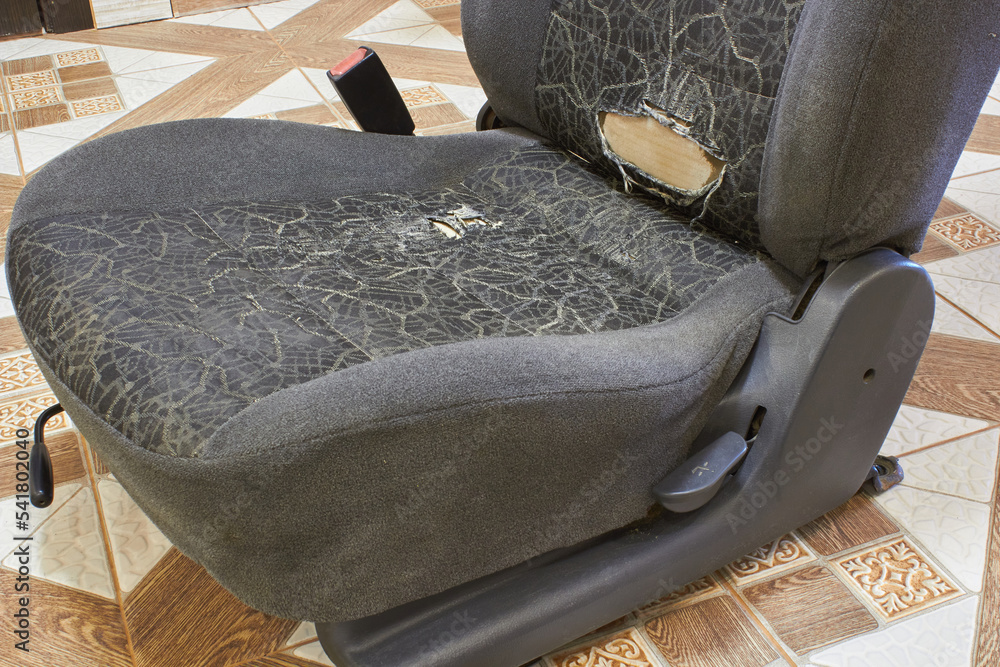 torn upholstery of the car seat,old chair with torn frame, car seat