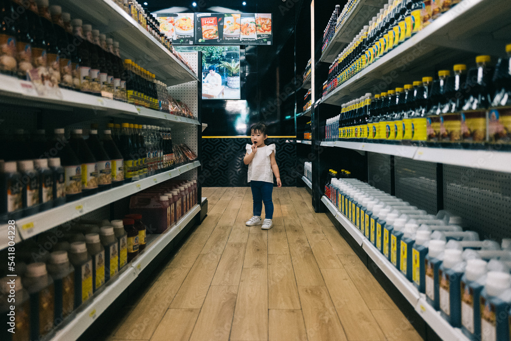 Little asian girl in supermarket Little asian girl in supermarket