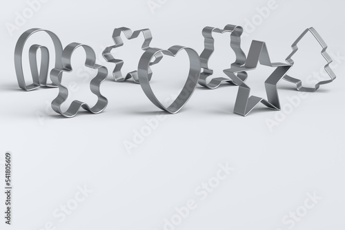 Fotografie Set of metal cookie cutters for homemade Christmas biscuit on a white
