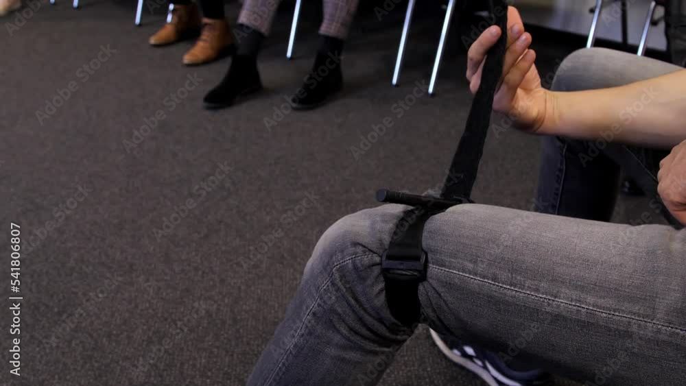 First aid instructor shows how to apply hemostatic tourniquets to stop