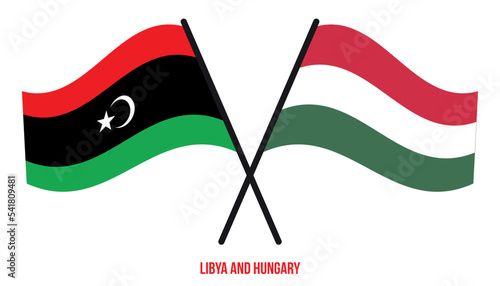 Libya and Hungary Flags Crossed And Waving Flat Style. Official Proportion. Correct Colors.