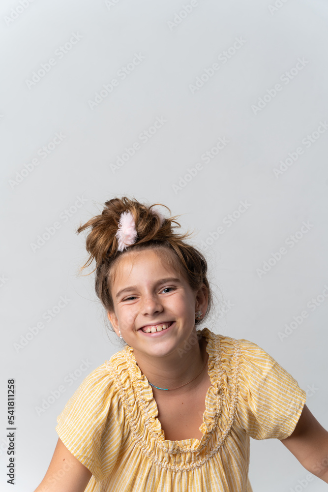 Girl in yellow dress with happy face expression Stock Photo | Adobe Stock