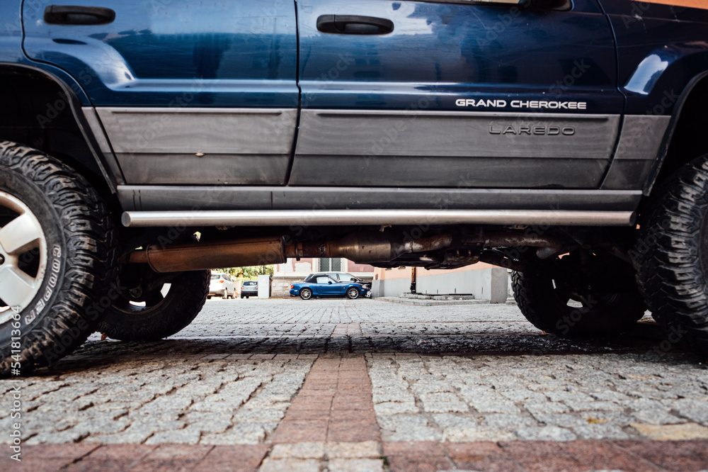 Cars with High and Low Ground Clearance. Two cars with low and high