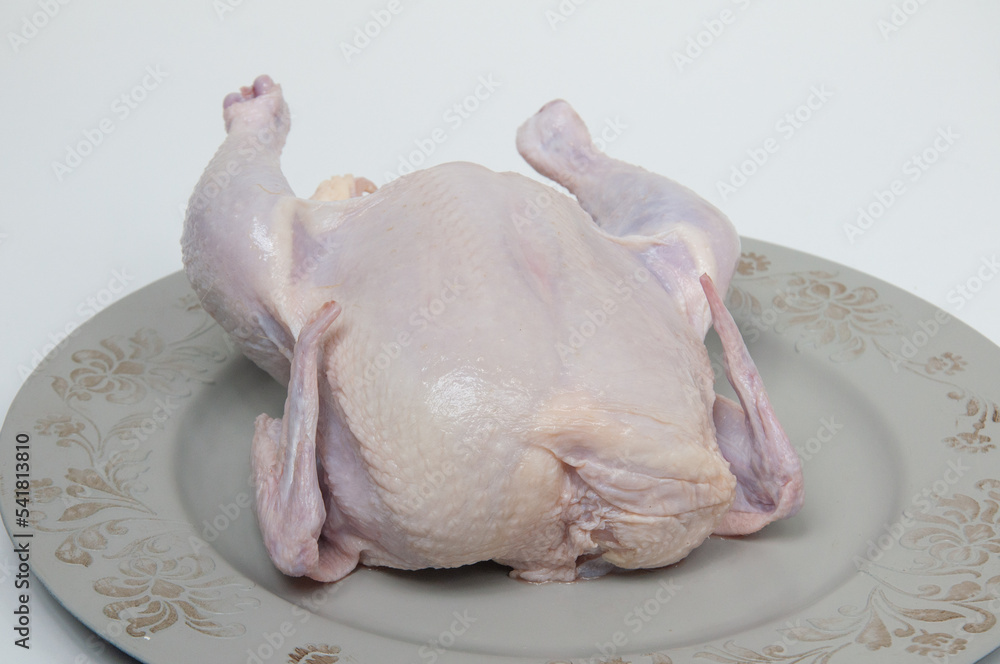 raw whole chicken on the table raw whole chicken on the table