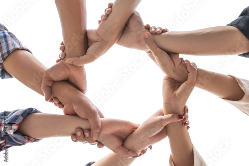 under view friendship People partnership teamwork crossed hands finishing up meeting show unity on white background , Business partner  teamwork concept photo