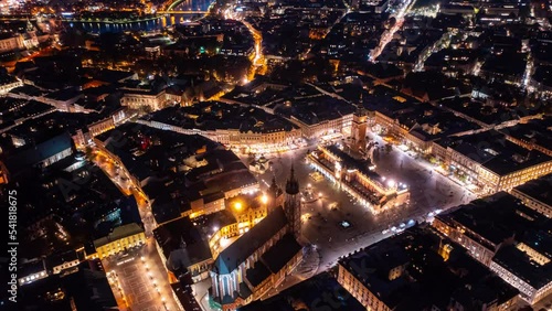 Krakow old city 4k night hyper lapse. Time lapse of the sunset in Krakow, Poland. Top view of old city center. Krakow Market Square, Poland, Time lapse. Main Square Cloth Hall Krakow time lapse.  photo