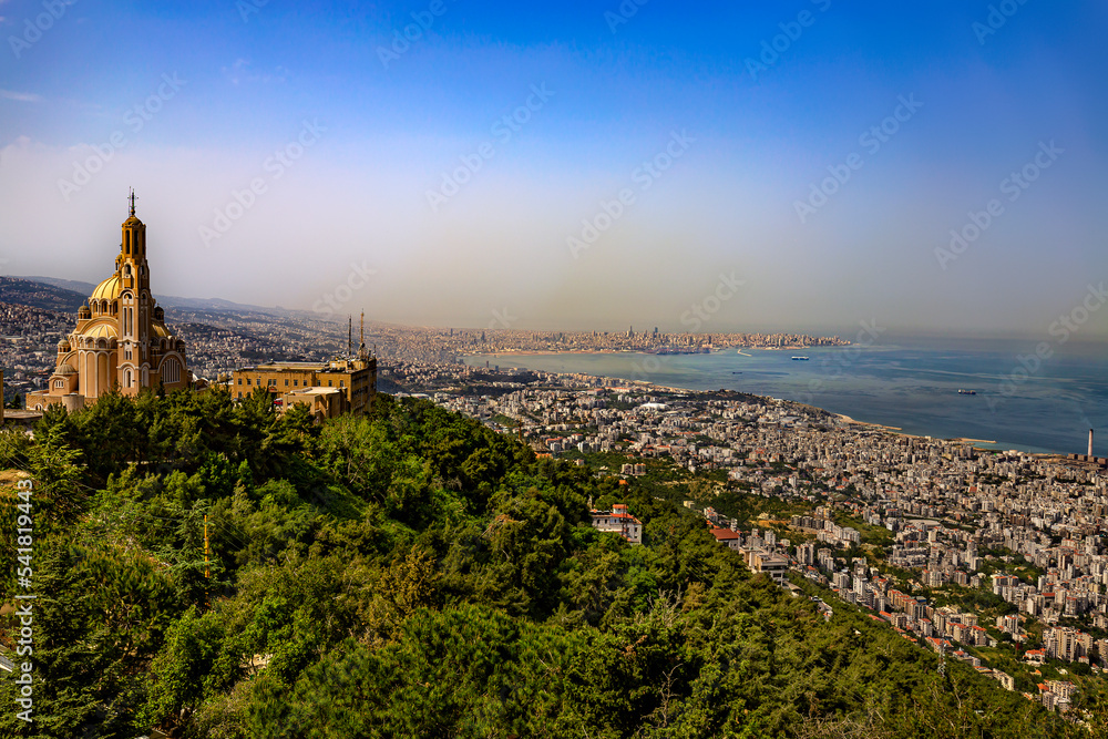 Lebanon. Jounieh. View of city from Harrisa, St. Paul Greek Melkite Basilica on the left side, there is skyline of Beirut in the background