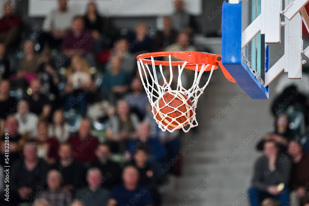 The ball falling into the basket during a basketball game Stock-Foto ...