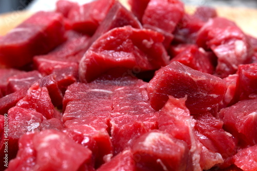 chopped raw meat. raw bovine meat. red meat being prepared for the meal.