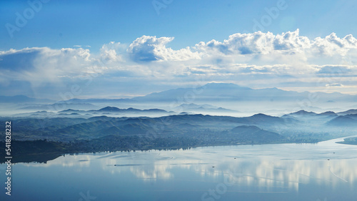 Overlooking Lake Elsinore with low clouds and haze among the hills