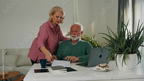 Senior couple going through finances together