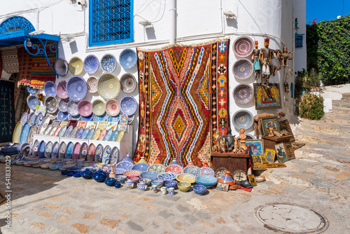 Traditional pottery and carpets on sale in Sidi Bou Said village near Carthage and Tunis, Tunisia photo
