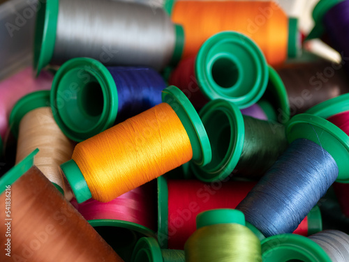 Colored sewing threads. Spools of multi-colored thread for sewing and embroidery machine