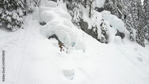 Backcountry Snowboard Trick Slow Motion 360 on Powder Pillows photo