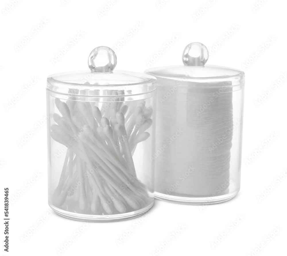 Cotton pads and swabs in plastic jars on white background Cotton pads and swabs in plastic jars on white background