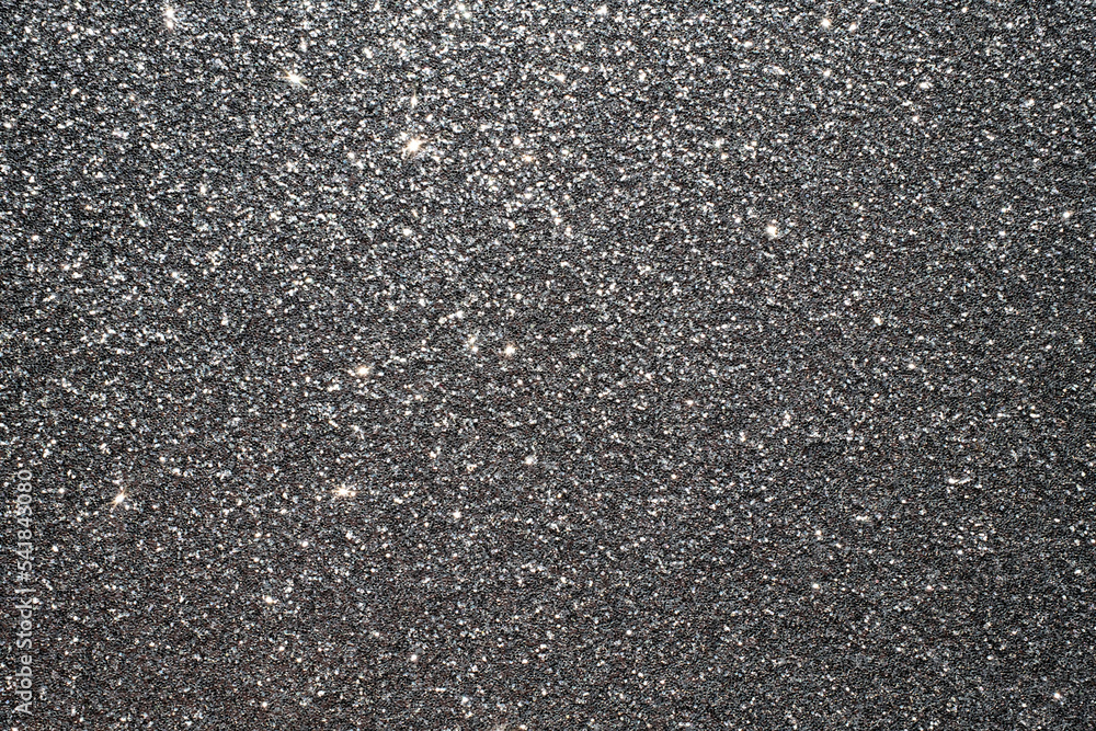 Textured background in dark gray. Place for text. Textured background in dark gray. Place for text.