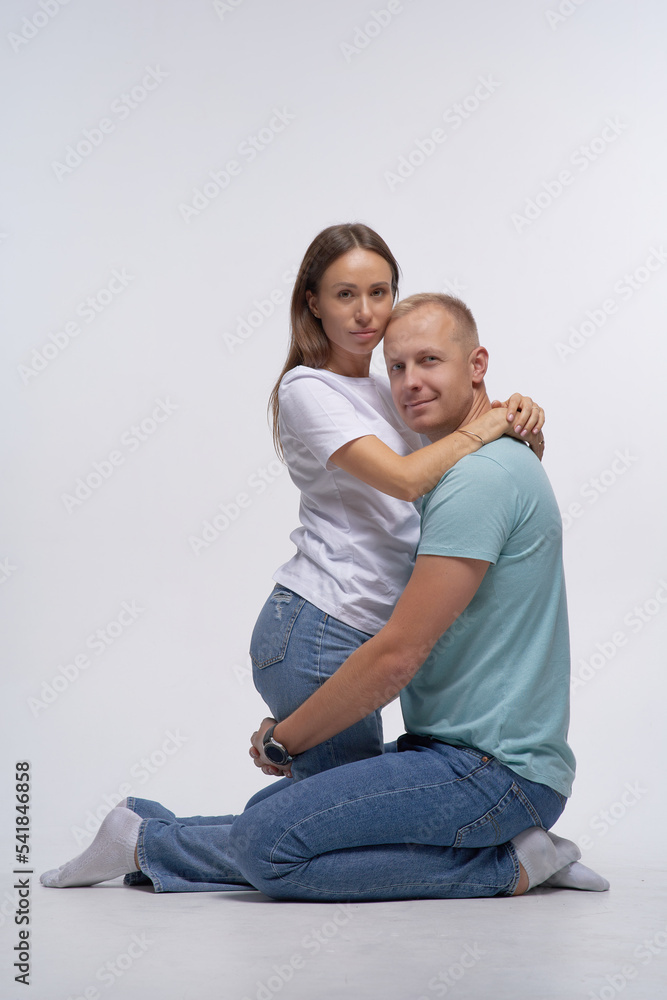 Happy smiling couple in love. Over white background.
Happy smiling couple in love. Over white background.