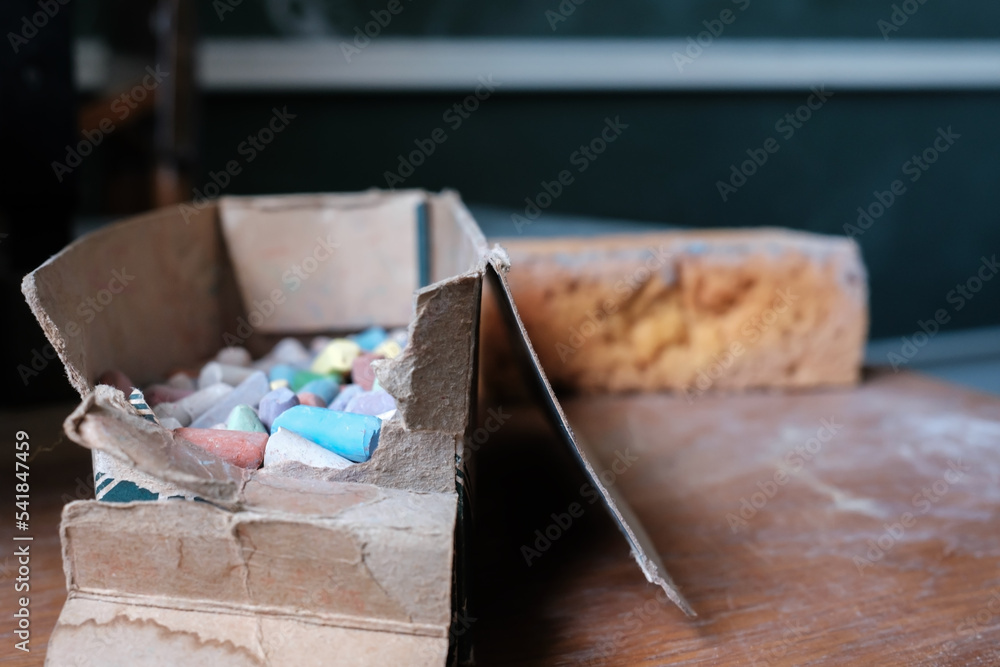 Box Rigged With Exploding Chalk Lots of colorful chalk pieces in a torn cardboard box. Stock Photo ...