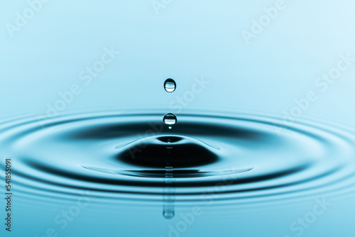 drops of water fall on a smooth surface and leave circles