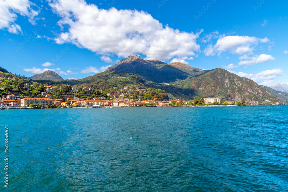 View from the lake of the lakefront commune of Tremezzina, Italy, including the towns of Mezzegra, Ossuccio and Tremezzo, along the shores of Lake Como, Italy, in the Lombardy region.