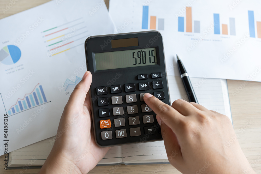 Woman calculate bill budget payment, home accounting concept with calculator. Woman calculate bill budget payment, home accounting concept with calculator.