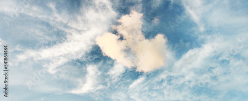Beautiful clear light blue sky with white clouds in sunny day. Wallpaper background.